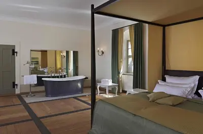 Ein Bett oder Betten in einem Zimmer der Unterkunft Barockschloss Rammenau