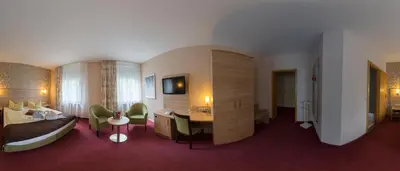 Ein Bett oder Betten in einem Zimmer der Unterkunft Hotel zur Post in Wurzen