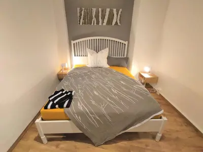 Ein Bett oder Betten in einem Zimmer der Unterkunft Kunstvoll - individuelle 4-Zimmer Ferienwohnung mit Balkon in Meißen