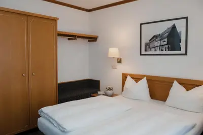 Ein Bett oder Betten in einem Zimmer der Unterkunft Hotel Alekto