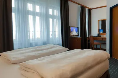 Ein Bett oder Betten in einem Zimmer der Unterkunft Hotel Alekto