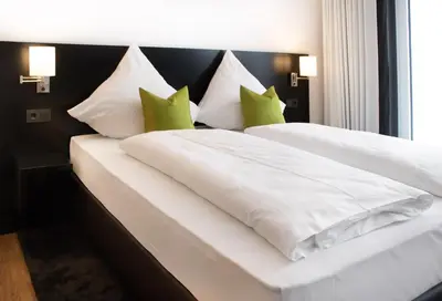 Ein Bett oder Betten in einem Zimmer der Unterkunft TO Hotel by WMM Hotels