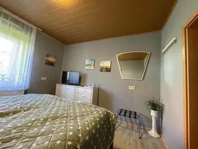 Ein Bett oder Betten in einem Zimmer der Unterkunft Fremdenzimmer Nossen