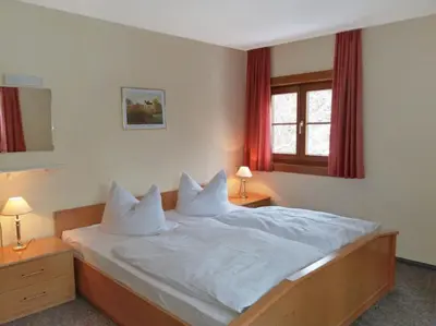Ein Bett oder Betten in einem Zimmer der Unterkunft Ferienhaus Haus Tanneck