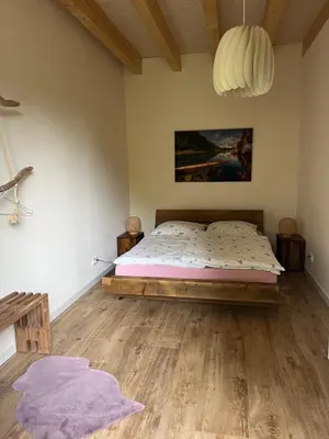 Ein Bett oder Betten in einem Zimmer der Unterkunft Ferienhaus Ulme in Naunhof Leipziger Neuseenland