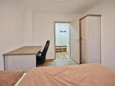 Ein Bett oder Betten in einem Zimmer der Unterkunft Gäste- und Ferienwohnung in der Sportstadt Riesa