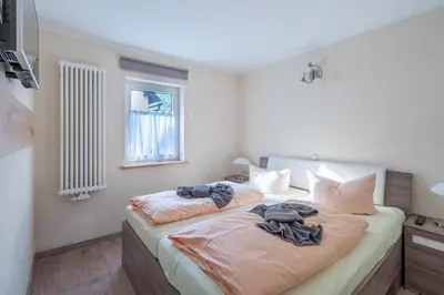 Ein Bett oder Betten in einem Zimmer der Unterkunft Ferienhaus Spielzeughof