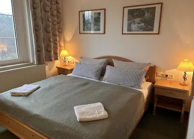 Ein Bett oder Betten in einem Zimmer der Unterkunft Das Muldenschlösschen