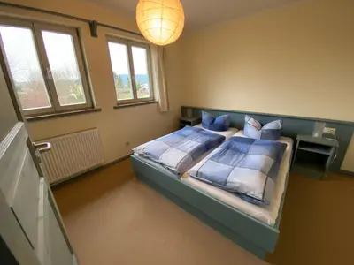 Ein Bett oder Betten in einem Zimmer der Unterkunft Haus Gamrigblick
