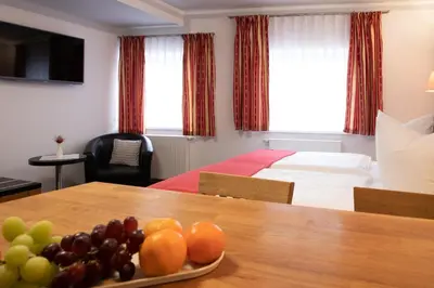 Ein Bett oder Betten in einem Zimmer der Unterkunft Hotel zur Kulturweberei
