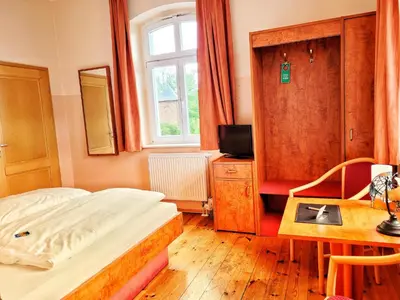 Ein Bett oder Betten in einem Zimmer der Unterkunft Kronprinz Falkenberg