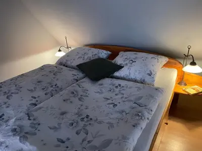 Ein Bett oder Betten in einem Zimmer der Unterkunft Ferienwohnung Eva