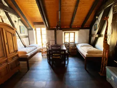 Ein Bett oder Betten in einem Zimmer der Unterkunft Ungewöhnliches Ferienhaus NAMIBIA-LODGE für 6 Pers - Rittergut Leppersdorf vor Radeberg bei Dresden