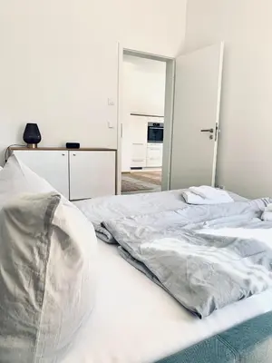 Ein Bett oder Betten in einem Zimmer der Unterkunft Modernes Apartment am See mit Terrasse