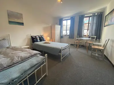 Ein Bett oder Betten in einem Zimmer der Unterkunft Fewo Sachsenhöhe