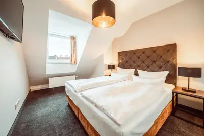 Ein Bett oder Betten in einem Zimmer der Unterkunft Familienapartment Am Neumarkt lll
