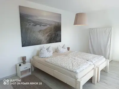Ein Bett oder Betten in einem Zimmer der Unterkunft Ferienwohnung Großdobritz
