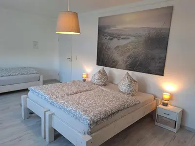 Ein Bett oder Betten in einem Zimmer der Unterkunft Ferienwohnung Großdobritz