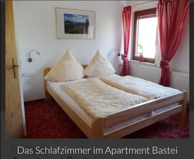 Ein Bett oder Betten in einem Zimmer der Unterkunft Guesthouse Elbsandstein App. Bastei