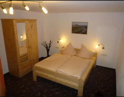 Ein Bett oder Betten in einem Zimmer der Unterkunft guesthouse Elbsandstein Appartement Lilienstein