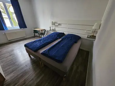 Ein Bett oder Betten in einem Zimmer der Unterkunft Private room in our home with cats