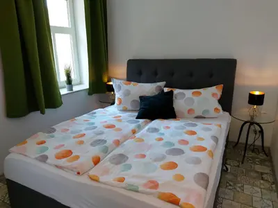 Ein Bett oder Betten in einem Zimmer der Unterkunft Pension zur Eiche GmbH