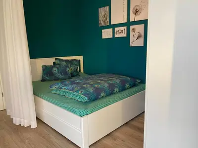 Ein Bett oder Betten in einem Zimmer der Unterkunft FEWO 