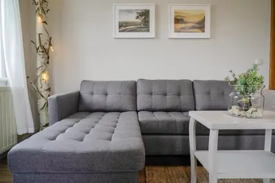 Ein Sitzbereich in der Unterkunft Urlaubsfreude Biedermann Haus GlücksStein Sandstein