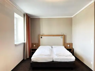 Ein Bett oder Betten in einem Zimmer der Unterkunft IBS Begegnungszentrum