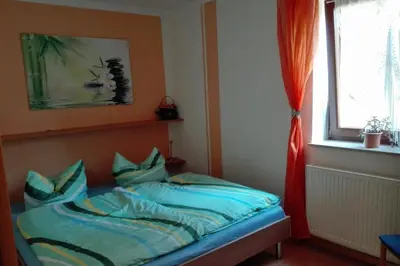 Ein Bett oder Betten in einem Zimmer der Unterkunft Ferienwohnungen Marle