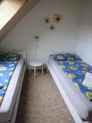Ein Bett oder Betten in einem Zimmer der Unterkunft Ferienwohnung Schlesinger
