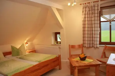 Ein Bett oder Betten in einem Zimmer der Unterkunft Ferienhof Schönfelder
