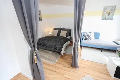 Ein Bett oder Betten in einem Zimmer der Unterkunft FullHouse - Chemnitz - M45 Apartments
