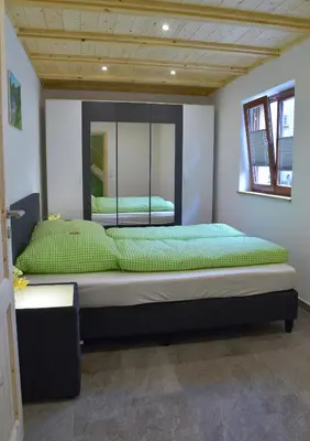 Ein Bett oder Betten in einem Zimmer der Unterkunft Ferienhof Kürschner