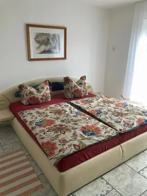 Ein Bett oder Betten in einem Zimmer der Unterkunft Ferienwohnungen Familie Lang