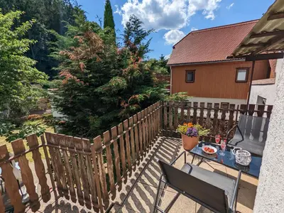 Ein Balkon oder eine Terrasse in der Unterkunft H6 -Urlaubsmagie- Wohnung für 3 mit Pool & Terrasse