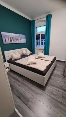 Ein Bett oder Betten in einem Zimmer der Unterkunft Ferienwohnung Kaiser