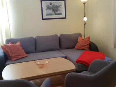Ein Sitzbereich in der Unterkunft Apartmenthaus Menge