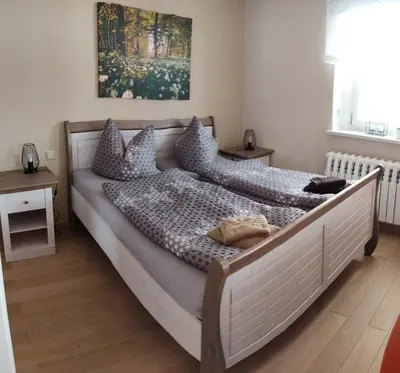 Ein Bett oder Betten in einem Zimmer der Unterkunft Ferienwohnung Zum Ausblick