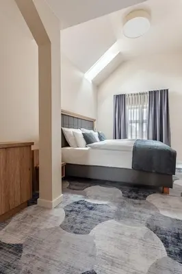 Ein Bett oder Betten in einem Zimmer der Unterkunft Hotel & Restaurant Rödersaal
