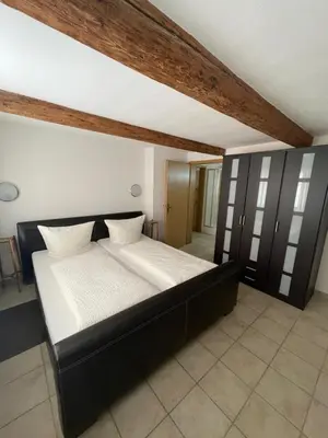 Ein Bett oder Betten in einem Zimmer der Unterkunft Ferienwohnung Keil