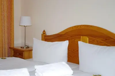 Ein Bett oder Betten in einem Zimmer der Unterkunft Landhaus Weißig & Rathen
