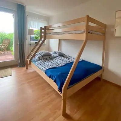 Ein Bett oder Betten in einem Zimmer der Unterkunft Ferienapartment Casa Heideblick mit Sonnenterrasse & Garten
