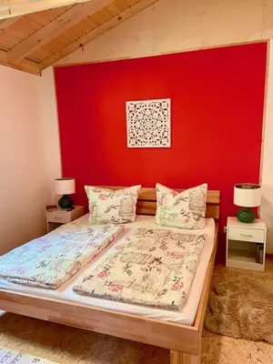 Ein Bett oder Betten in einem Zimmer der Unterkunft Ferienhaus Blumenwiese
