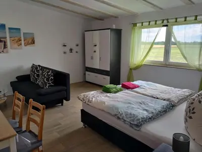 Ein Bett oder Betten in einem Zimmer der Unterkunft Ferienwohnung am See