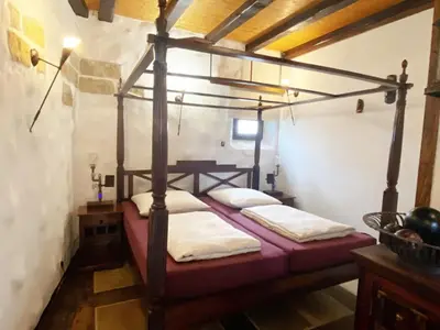 Ein Bett oder Betten in einem Zimmer der Unterkunft Fewo NAMIBIA-LODGE im Rittergut Leppersdorf bei Dresden