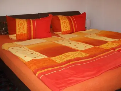 Ein Bett oder Betten in einem Zimmer der Unterkunft Ferienwohnung Böhme