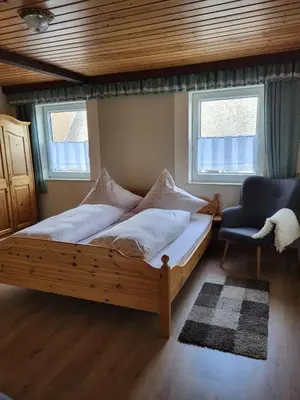 Ein Bett oder Betten in einem Zimmer der Unterkunft Ferienwohnung Augustusburg