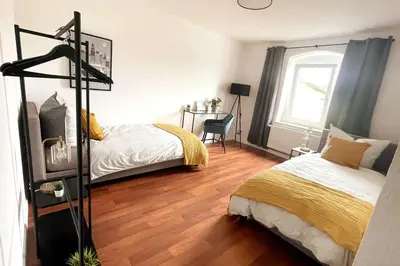 Ein Bett oder Betten in einem Zimmer der Unterkunft Modern 4 Zi Rooms Netflix, Wifi, Parken CasaLuna85