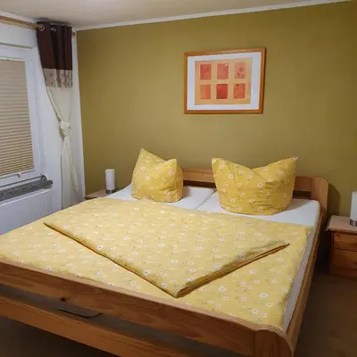Ein Bett oder Betten in einem Zimmer der Unterkunft Ferienhaus Willkommen